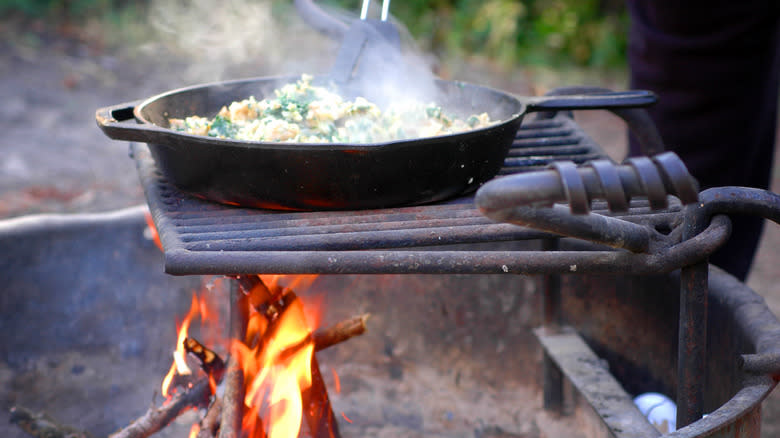 Cast iron skillet over flames