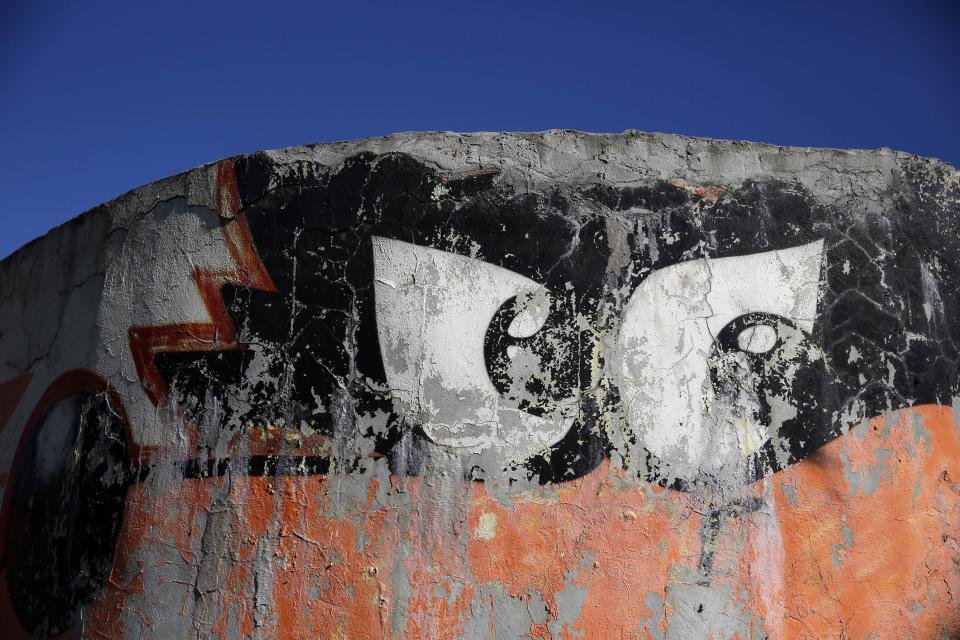 REFILE CORRECTING TYPO IN SARAJEVO A picture of "Vucko", the official mascot of the Winter Olympics in Sarajevo, is seen at Zetra hall, the venue for the figure skating in Sarajevo October 27, 2013. Abandoned and left to crumble into oblivion, most of the 1984 Winter Olympic venues in Bosnia's capital Sarajevo have been reduced to rubble by neglect as much as the 1990s conflict that tore apart the former Yugoslavia. The bobsleigh and luge track at Mount Trebevic, the Mount Igman ski jumping course and accompanying objects are now decomposing into obscurity. The bobsleigh and luge track, which was also used for World Cup competitions after the Olympics, became a Bosnian-Serb artillery stronghold during the war and is nowadays a target of frequent vandalism. The clock is now ticking towards the 2014 Winter Olympics, with October 29 marking 100 days to the opening of the Games in the Russian city of Sochi. Picture taken on October 27, 2013. REUTERS/Dado Ruvic (BOSNIA AND HERZEGOVINA - Tags: SPORT FIGURE SKATING SOCIETY OLYMPICS) ATTENTION EDITORS: PICTURE 07 OF 23 FOR PACKAGE 'SARAJEVO'S WINTER OLYMPIC LEGACY'. TO FIND ALL IMAGES SEARCH 'DADO IGMAN'