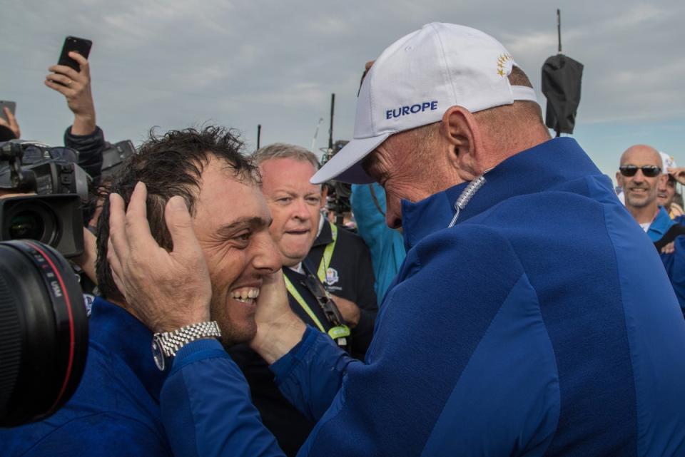 Bjorn hugs Francesco Molinari as he secures the winning point at Le Golf National in 2018 (Getty)