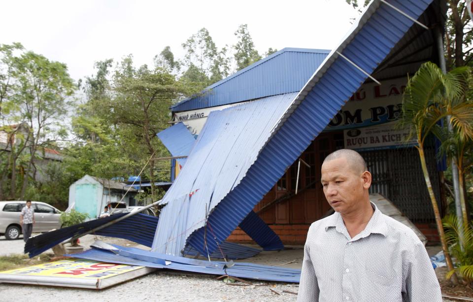 A man walks in front of his damaged restaurant at Ha Long Bay in the aftermath of typhoon Haiyan in Vietnam's northern Quang Ninh province, 180 km (112 miles) from Hanoi November 11, 2013. (REUTERS/Kham)