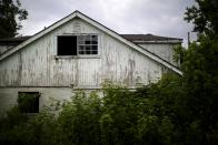 An abandoned house after Hurricane Katrina is seen in the Lower Ninth Ward neighborhood of New Orleans, Louisiana, August 18, 2015. (REUTERS/Carlos Barria)