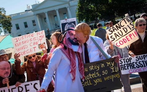 Protesters accuse Donald Trump of being too close to Saudi leaders - Credit: Jim Watson/AFP