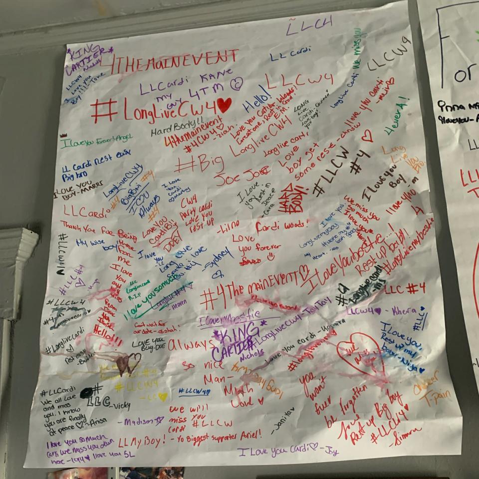 Poster signed by Northwestern High School students, in memory of Cartier Woods.