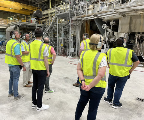 Touring the paper making process.  (Photo: Business Wire)