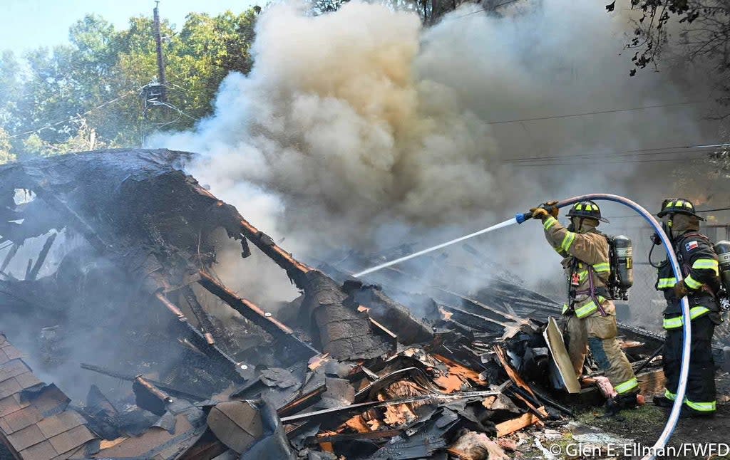 Two Navy pilots were injured after ejecting as their plane crashed in the North Texas neighbourhood of Lake Worth (Glen E. Ellman/FWFD)