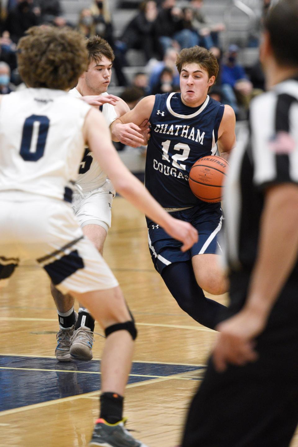 Chatham boys basketball at Randolph on Friday, December 17, 2021. C #12 Ryan Leskauskas drives to the basket in the second period. 