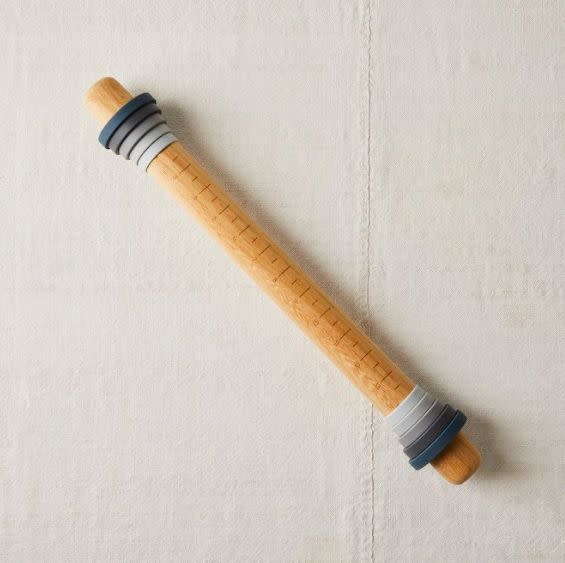 Find this <a href="https://fave.co/3dKmEYA" target="_blank" rel="noopener noreferrer">Five Two Adjustable Rolling Pin for $39</a> with adjustable sizes and measurements at Food52.