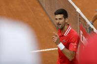 Serbia's Novak Djokovic reacts during his final match against Spain's Rafael Nadal, at the Italian Open tennis tournament, in Rome, Sunday, May 16, 2021. (AP Photo/Gregorio Borgia)