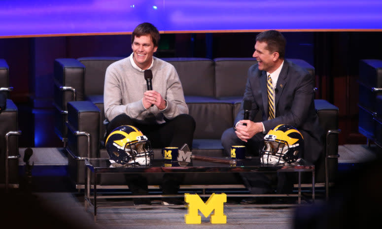 Tom Brady, former Michigan Wolverine and current NFL quarterback talks with Head coach Jim Harbaugh of the Michigan Wolverines.