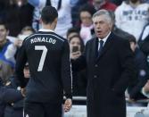 Real Madrid's Cristiano Ronaldo (L) walks past his coach Carlo Ancelotti after receiving a red card during their Spanish First Division soccer match against Cordoba at El Arcangel stadium in Cordoba, January 24, 2015. REUTERS/Marcelo del Pozo