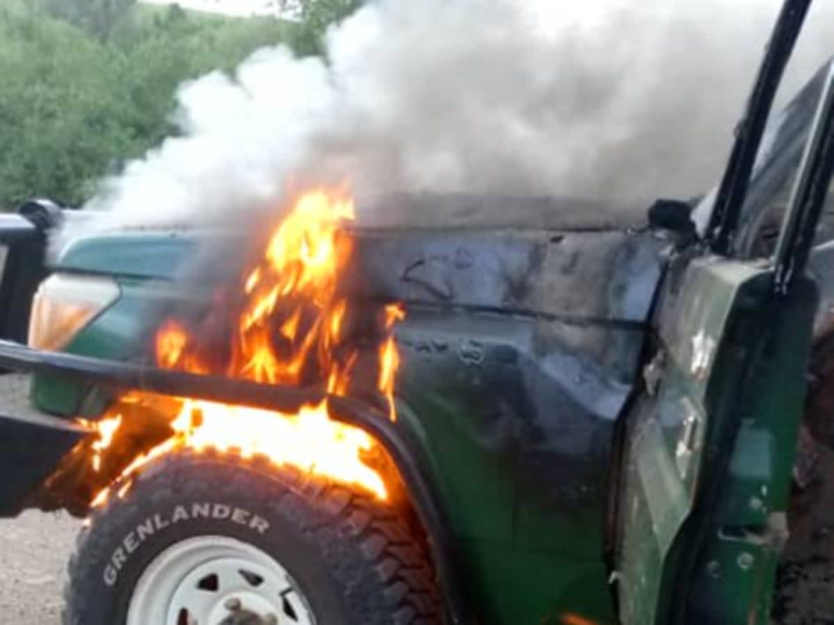 The car the trio was travelling in was found still on fire in the national park (Uganda Police Force)