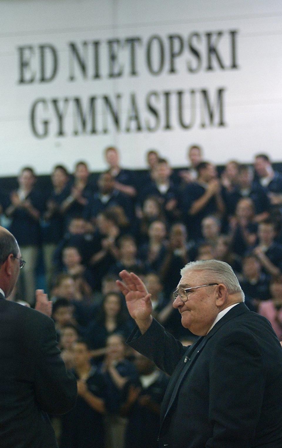 Ed Nietopski gets a standing ovation from students and staff at Bishop Kearney in 2004 in the gymnasium named after him.