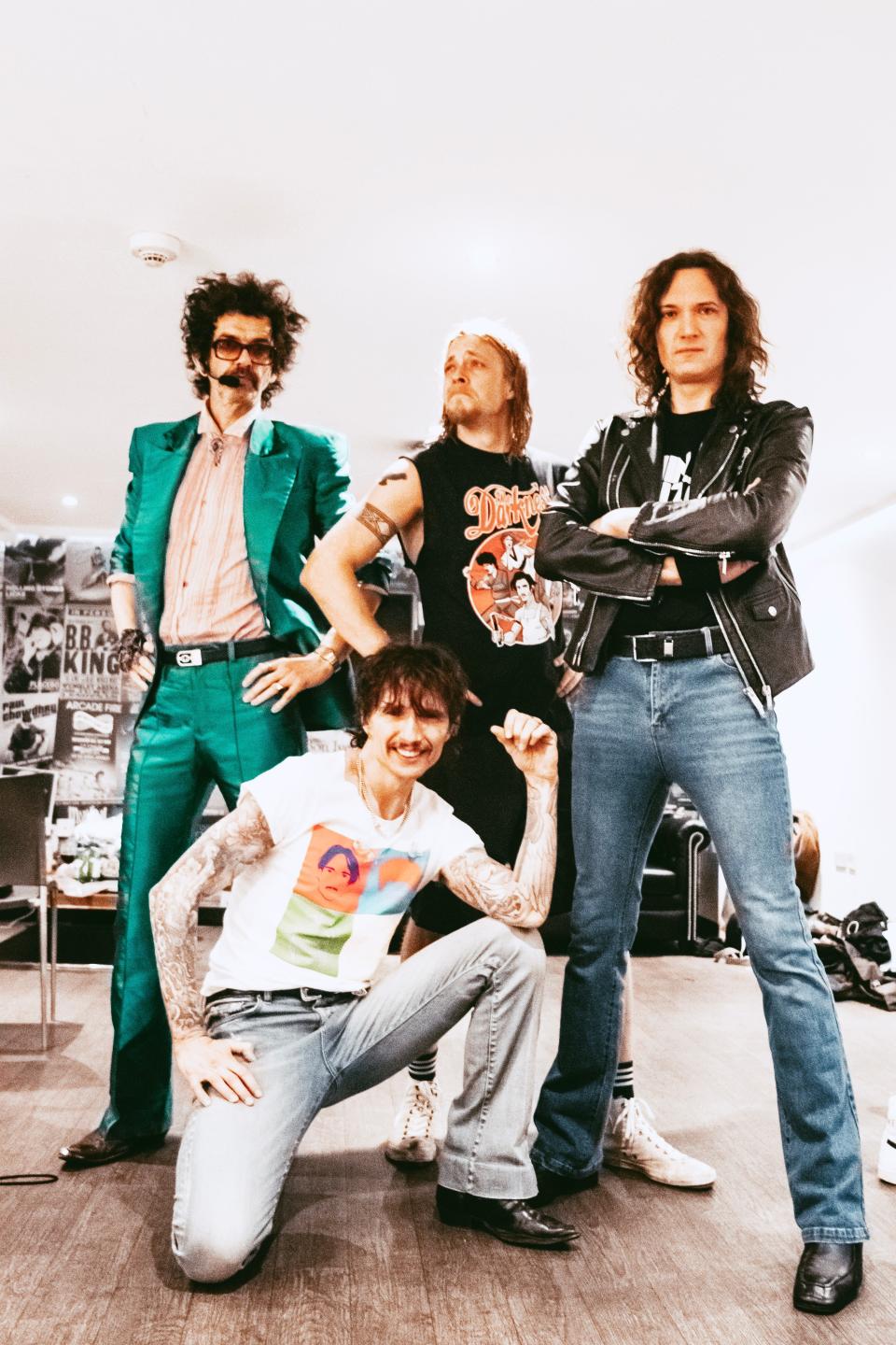 The Darkness: From left, bassist Frankie Poullain, singer Justin Hawkins, drummer Rufus Tiger Taylor and guitarist Dan Hawkins. The band is celebrating the 20th anniversary of its landmark "Permission to Land" album.