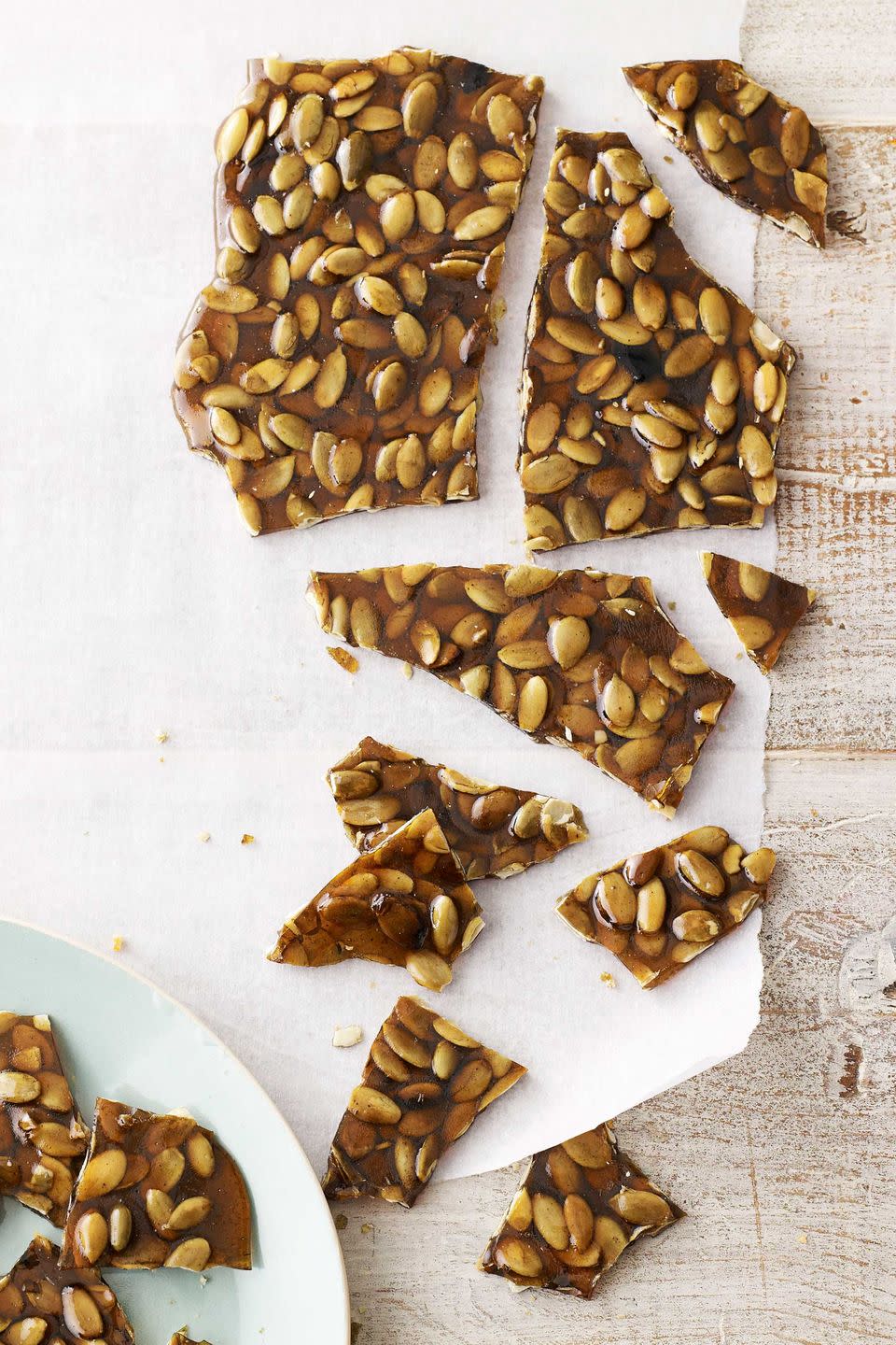 <p>Crunchy raw pepitas and warm cinnamon add a salty-sweet-spicy burst of flavor to a basic brittle.</p><p><strong><a href="https://www.countryliving.com/food-drinks/recipes/a4154/pumpkin-seed-brittle-recipe-clv0213/" rel="nofollow noopener" target="_blank" data-ylk="slk:Get the recipe;elm:context_link;itc:0;sec:content-canvas" class="link ">Get the recipe</a>.</strong></p>