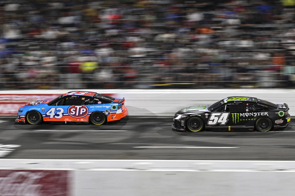 Erik Jones (43) and Ty Gibbs (54) compete during the NASCAR All-Star Cup Series auto race at North Wilkesboro Speedway, Sunday, May 21, 2023, in North Wilkesboro, N.C. (AP Photo/Matt Kelley)