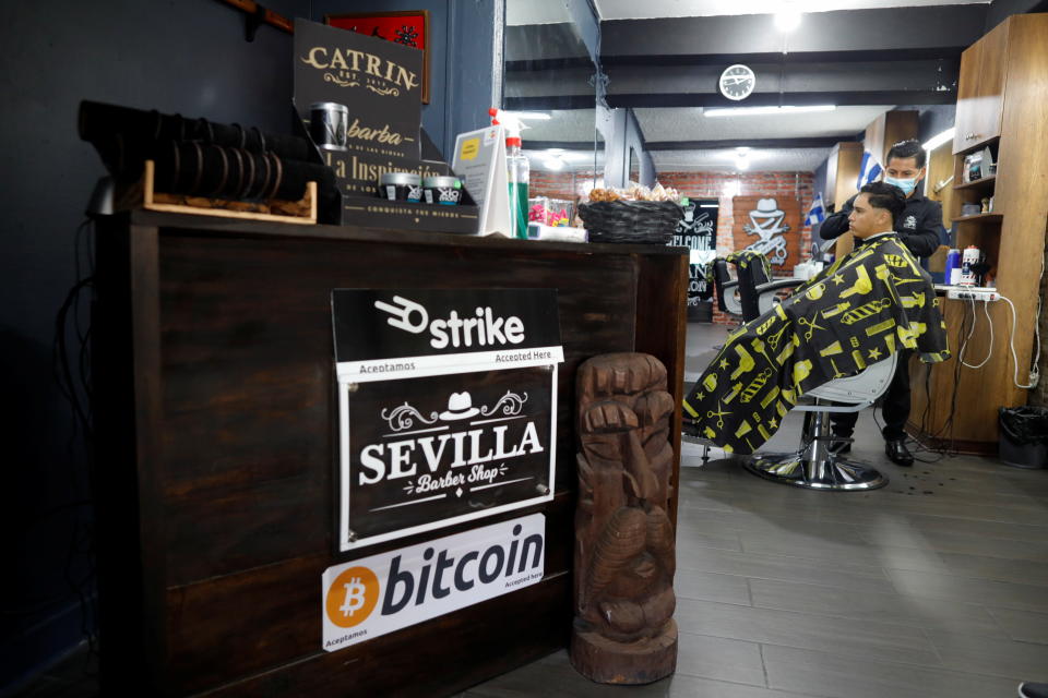 A barber works at Sevilla Barber Shop where Bitcoin is accepted as a payment method, in Santa Tecla, El Salvador September 6, 2021. REUTERS/Jose Cabezas