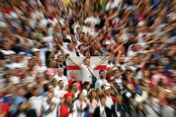 <p>England supporters sing the national anthem during the Russia 2018 World Cup semi-final football match between Croatia and England at the Luzhniki Stadium in Moscow on July 11, 2018. (Photo by MANAN VATSYAYANA / AFP) </p>