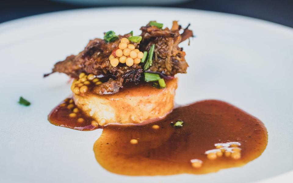 Braised short rib, on polenta with mustard seed is served  during the IndyStar Wine & Food Experience, held at Clay Terrace outdoor mall in Carmel Ind., on Saturday, Sept. 28, 2019. 