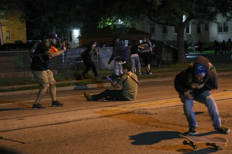 Gaige Grosskreutz, left,  was shot in the arm during protests in Kenosha. Anthony Huber, right, was shot in the chest and killed. Kyle Rittenhouse, shown on the ground, was charged in the shootings.