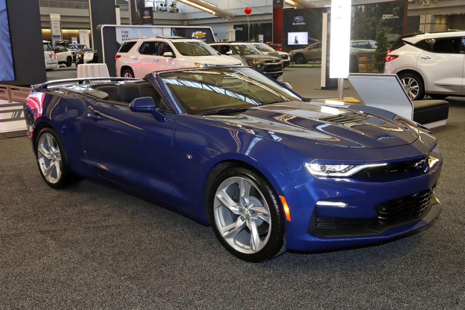 FILE - This is a 2020 Camaro on display at the 2020 Pittsburgh International Auto Show, Feb. 13, 2020, in Pittsburgh. The Chevrolet Camaro, for years the dream car of many teenage American males, is going out of production. General Motors, which sells the brawny muscle car, said Wednesday, March 22, 2023, that it will stop making the current generation early next year. (AP Photo/Gene J. Puskar, File)