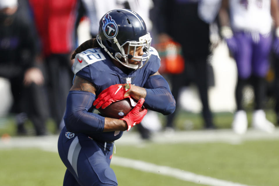 Tennessee Titans running back Derrick Henry carries the ball against the Baltimore Ravens in the first half of an NFL wild-card playoff football game Sunday, Jan. 10, 2021, in Nashville, Tenn. (AP Photo/Wade Payne)