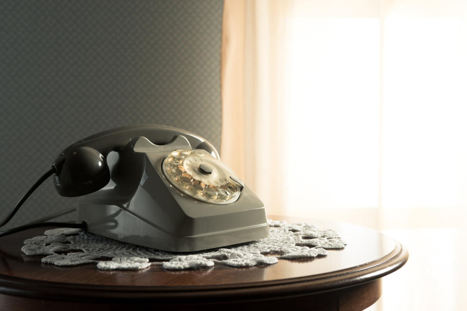 a rotary telephone on a table