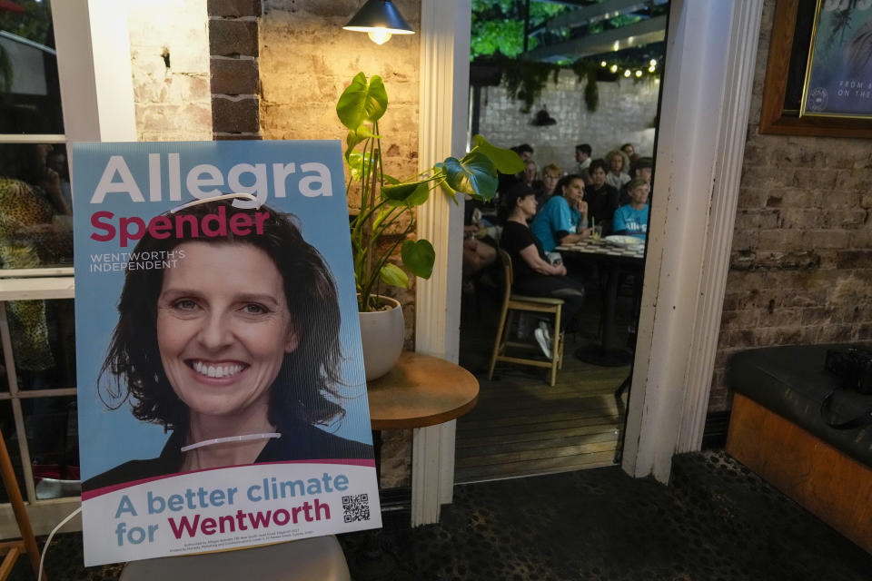 People listen as Independent candidate for the inner city seat of Wentworth, Allegra Spender, holds a public forum ahead of next weekend's general election in Sydney, Australia on May 16, 2022. Australia's government, considered a laggard on combating climate change, faces a new threat in the form of highly-organized and well-funded independent election candidates who demand deeper cuts on greenhouse gas emissions. (AP Photo/Mark Baker)