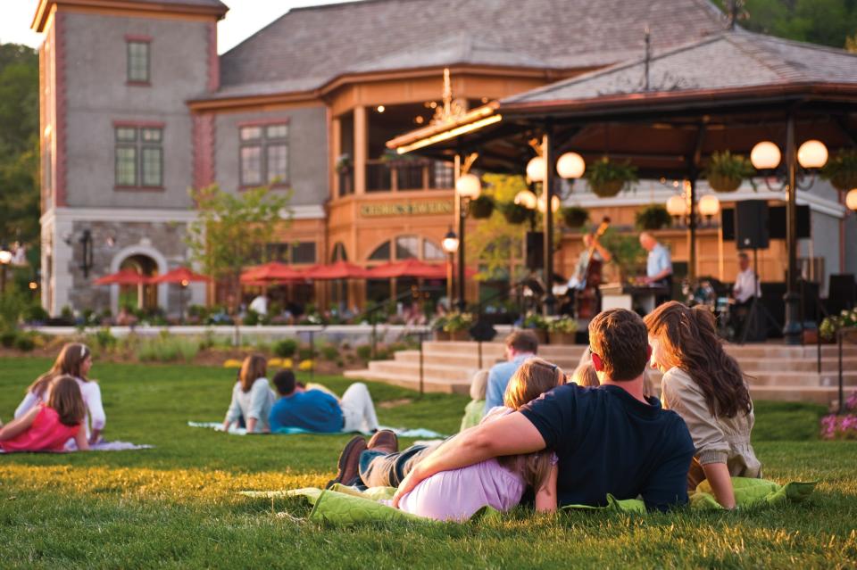 Guests enjoy an outdoor concert on the lawn at Antler Hill Village at Biltmore Estate.