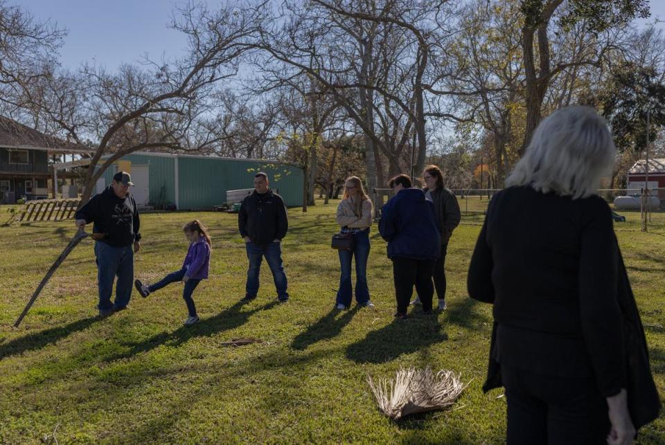 Family and loved ones of Donald Green gather at a backyard during Green's celebration of life in Freeport, on Dec. 16, 2023.