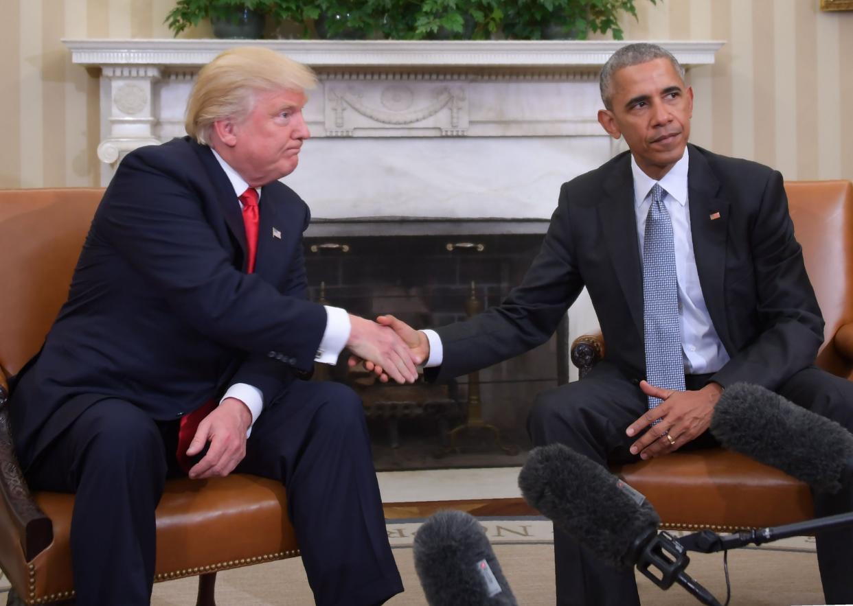 An uneasy handshake between Donald Trump and Barack Obama during the transition between their presidencies: AFP via Getty Images