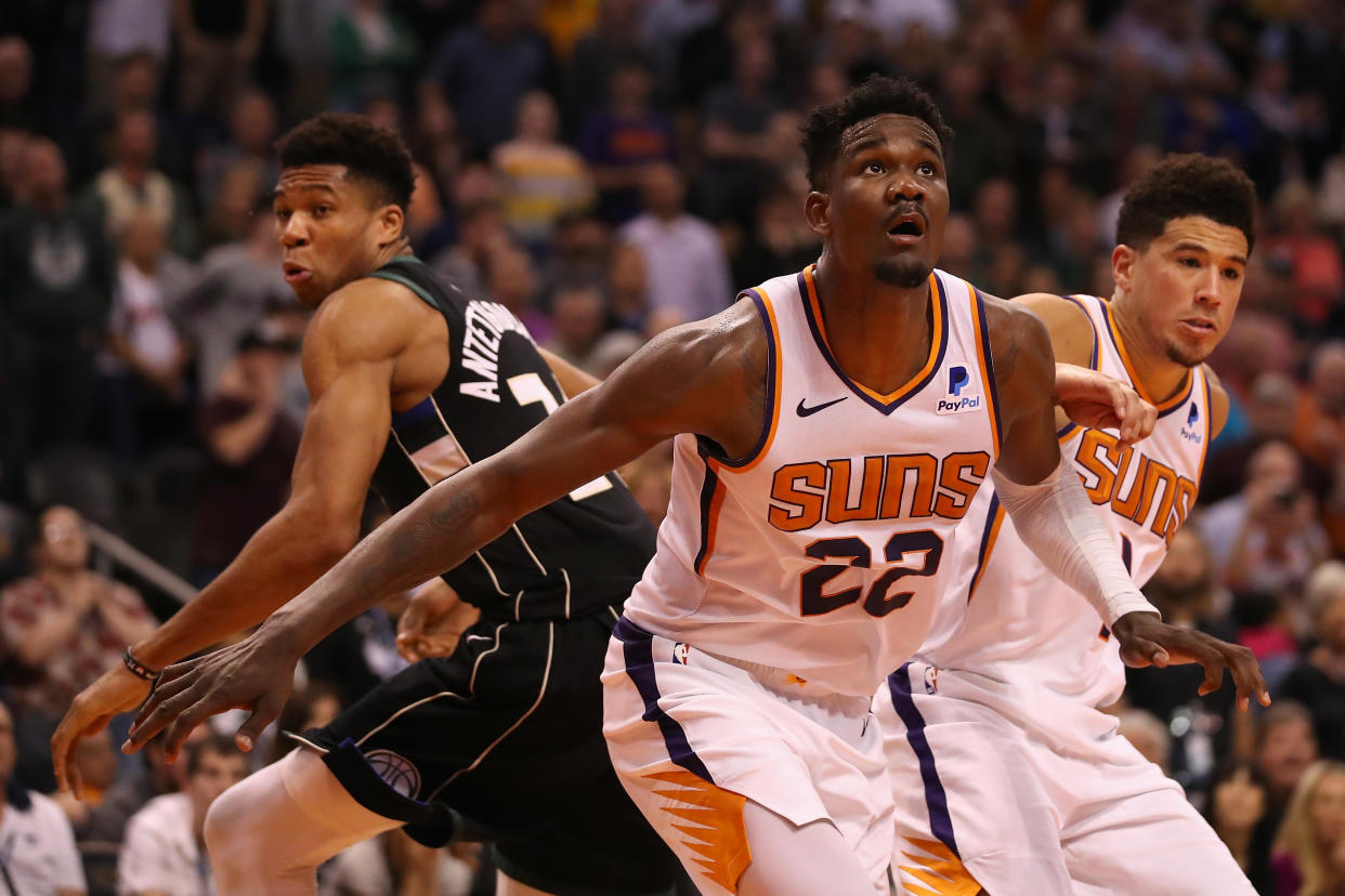Giannis Antetokounmpo, Deandre Ayton and Devin Booker are among a generation of bright young NBA stars. (Christian Petersen/Getty Images)