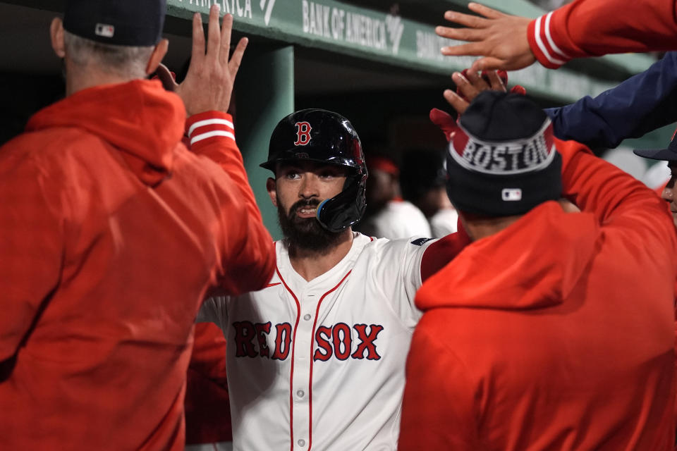 Boston Red Sox's Connor Wong is congratulated for his solo home run off Cleveland Guardians pitcher Ben Lively during the fourth inning of a baseball game Wednesday, April 17, 2024, in Boston. (AP Photo/Charles Krupa)