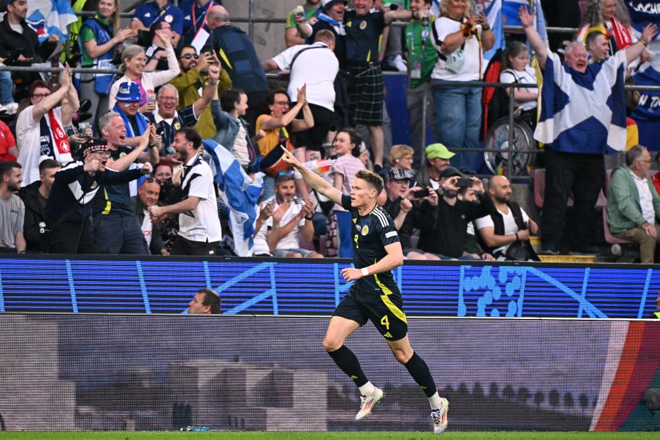 Scott McTominay celebrates with Scottish fans (AFP via Getty Images)