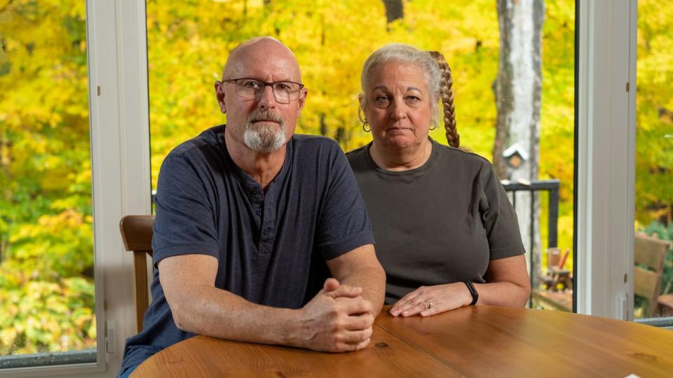 Conrad and Janice Namiesniowski sit at their kitchen table in Ottawa's Orléans neighbourhood. 'It’s a hopelessness. There seems to be no solution and we’re left hanging,' Conrad said of his experience trying to reach an agent at Canada Life after his wife's drug coverage was cut off. 