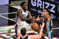 Philadelphia 76ers guard Shake Milton, left, loses control of the ball aas Memphis Grizzlies guard Desmond Bane, right, defends during the second half of an NBA basketball game Saturday, Jan. 16, 2021, in Memphis, Tenn. (AP Photo/Brandon Dill)