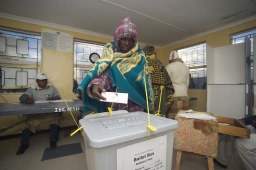 A Basotho man casts his vote at a polling station some 20kms outside Maseru. Lesotho counted ballots Saturday after a tight general election -- dominated by personal clashes rather than concerns over poverty -- that could produce the southern African nation's first coalition government