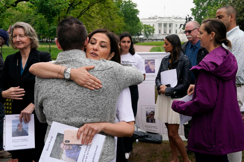 Neda Shargi, sister of Iranian prisoner Emad Shargi, hugs former Syrian hostage Sam Goodwin before a news conference with families of Americans currently being held hostage or wrongfully detained overseas in Lafayette Park near the White House, Wednesday, May 4, 2022, in Washington.<span class="copyright">Patrick Semansky—AP</span>