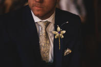 <p>Even the groom had a Harry Potter passage on him, in the form of a cute flower pin. </p>