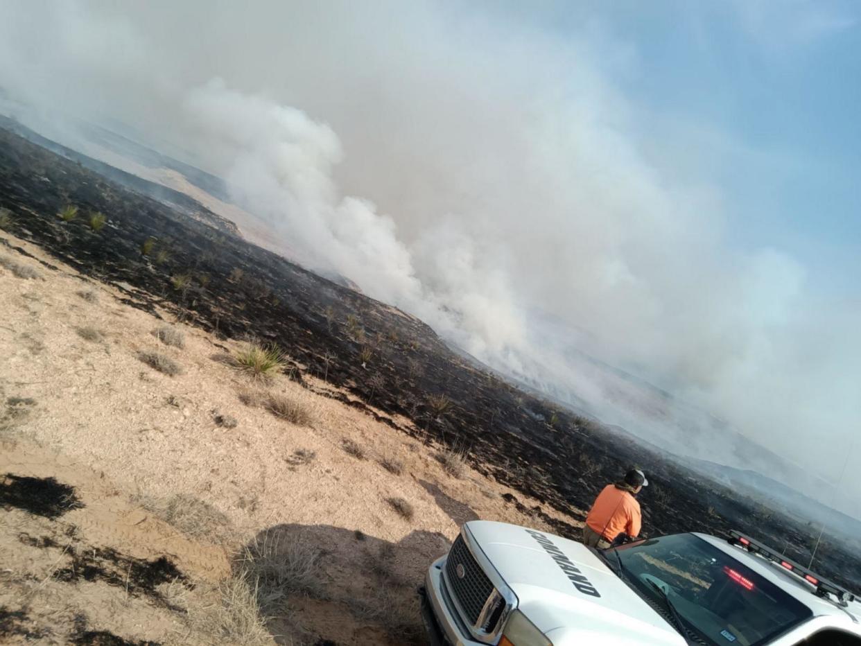 PHOTO: Firefighters survey wildfire damage in Pampa, Texas. (Gage Hardman)