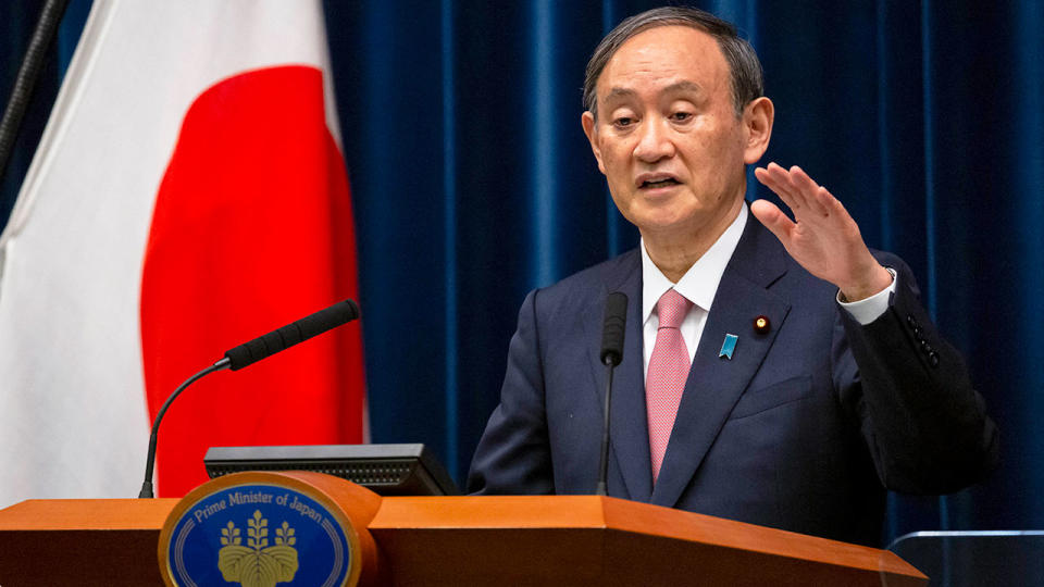 Seen here speaking to the media is Japanese Prime Minister Yoshihide Suga.