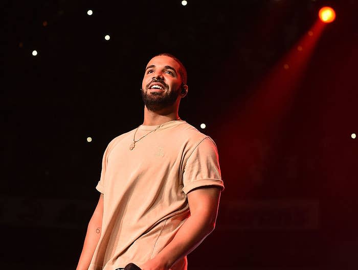 Drake smiling onstage