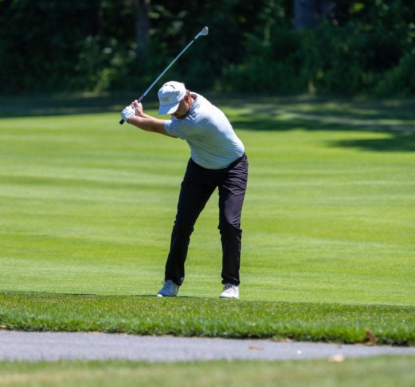 North Hampton's Ryan Quinn prepares to hit his approach shot on the ninth hole during the opening round of Thursday's New Hampshire Open at Breakfast Hill Golf Club in Greenland.