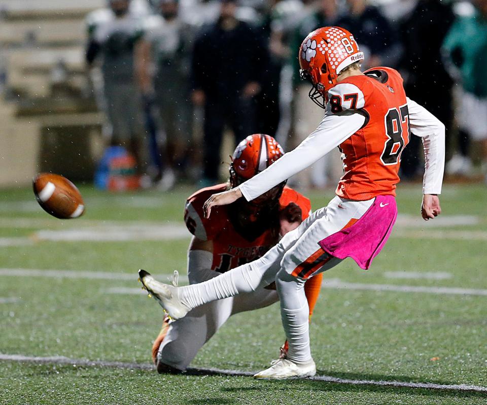 Mansfield Senior High School's Quinten DeBolt (87) kicks an extra point against Madison High School in the first quarter during high school football action Friday, Oct. 20, 2023 at Arlin Field. TOM E. PUSKAR/MANSFIELD NEWS JOURNAL