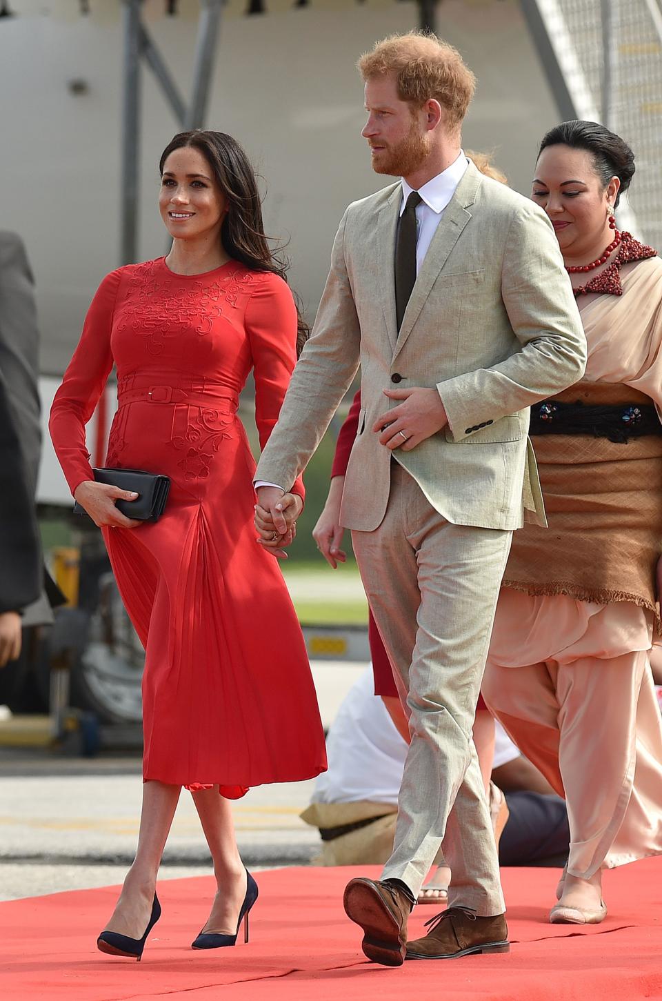 <p>The couple arrived in Tonga for the tenth day of their royal tour on October 25 and the Duchess chose a red Self-Portrait dress for the occasion. <em>[Photo: Getty]</em> </p>