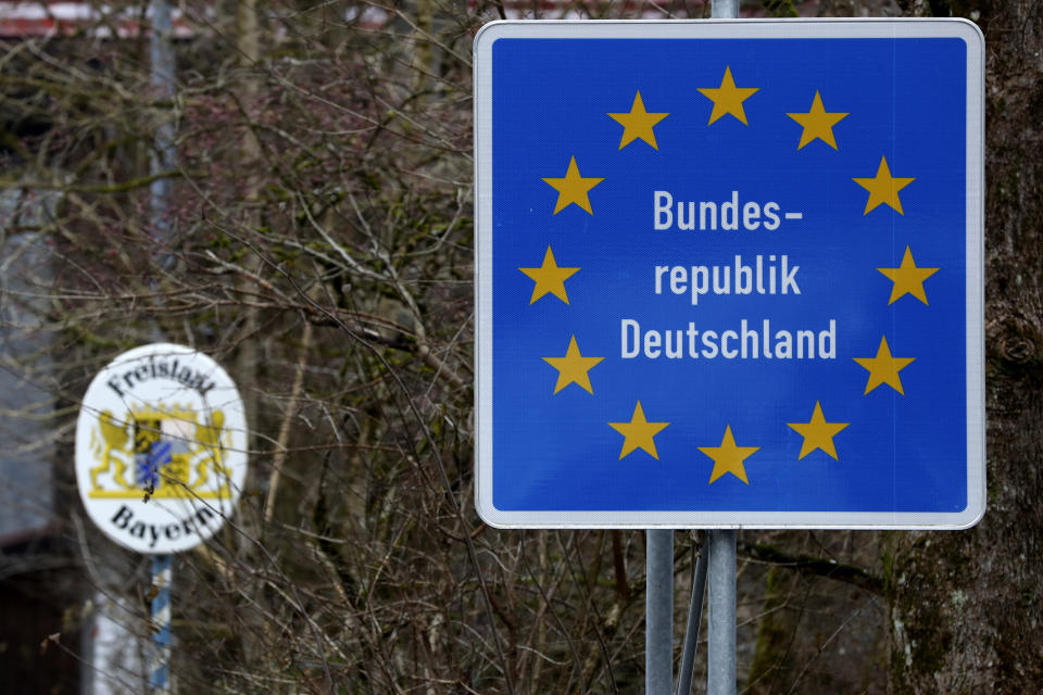 FILE - A German border sign stands at the Austrian-German border in Sachrang, Germany, Thursday, Dec. 10, 2020. German lawmakers have approved legislation easing rules to gain citizenship and ending restrictions on holding dual citizenship. (AP Photo/Matthias Schrader, File)