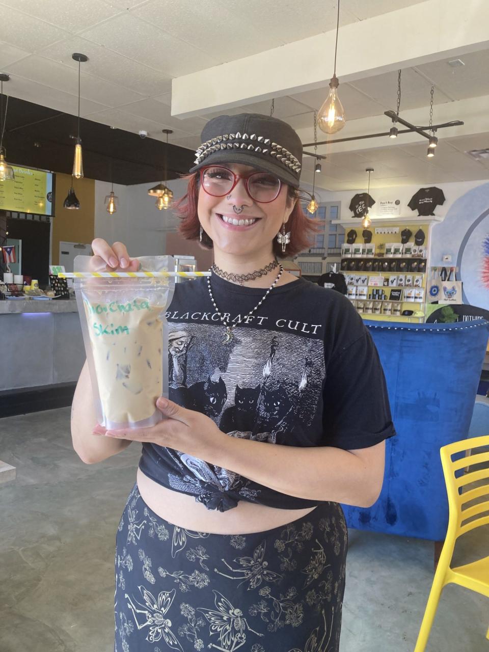 Sasini Salazar serves a tasty Horchata latte in a recyclable bag at 787 Coffee house in Central El Paso. The shop is only two months old but attracting new customers every day.