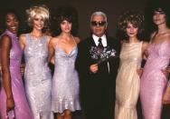 <p>As creative director of Chanel, the late Karl Lagerfeld was always surrounded by the industry's top faces: here, the late designer posed with Naomi Campbell, Claudia Schiffer, Amber Valletta, Kate Moss and Stella Tennant at the Chanel ready-to-wear Spring/Summer 1996/1997 show in Paris. </p>