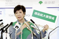 Tokyo Governor Yuriko Koike speaks during a press conference after a task force meeting against the new coronavirus at the Metropolitan Government Office Thursday, July 2, 2020, in Tokyo. The Japanese capital has confirmed more than 100 new cases of the coronavirus, the highest since early May, raising concern about a possible resurgence of the disease just as businesses return to normal. Gov. Koike, at a meeting with a panel of experts, said the infections are on the rise and extra caution is needed. Koike said many of the cases are linked to nightlife establishments, and urged workers to proactively take virus tests and further safety measures. (Kyodo News via AP)