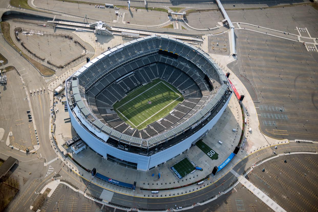 New York Giants, MetLife Stadium, East Rutherford, New Jersey, aerial view of the field with roads and parking lots surrounding it, empty field, seatings, roads, and parking lots