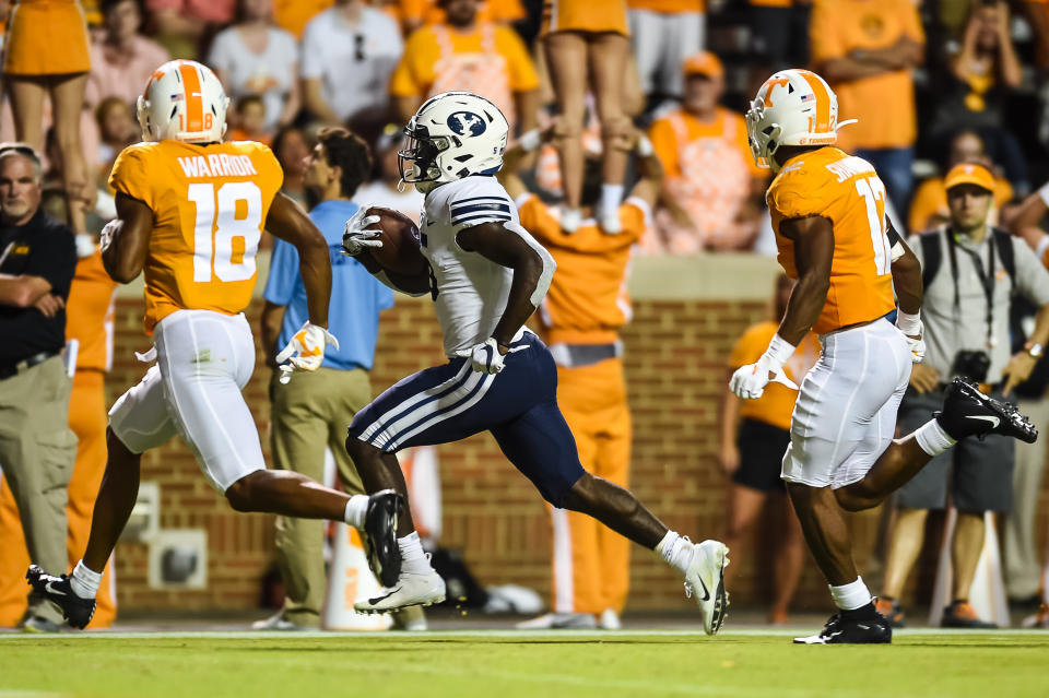 KNOXVILLE, TN - SEPTEMBER 7: Brigham Young Cougars running back Ty'Son Williams (5) runs the ball past Tennessee Volunteers defensive back Shawn Shamburger (12) and defensive back Nigel Warrior (18) for a touchdown during a college football game between the Tennessee Volunteers and Brigham Young Cougars on September 7, 2019, at Neyland Stadium in Knoxville, TN. (Photo by Bryan Lynn/Icon Sportswire via Getty Images)